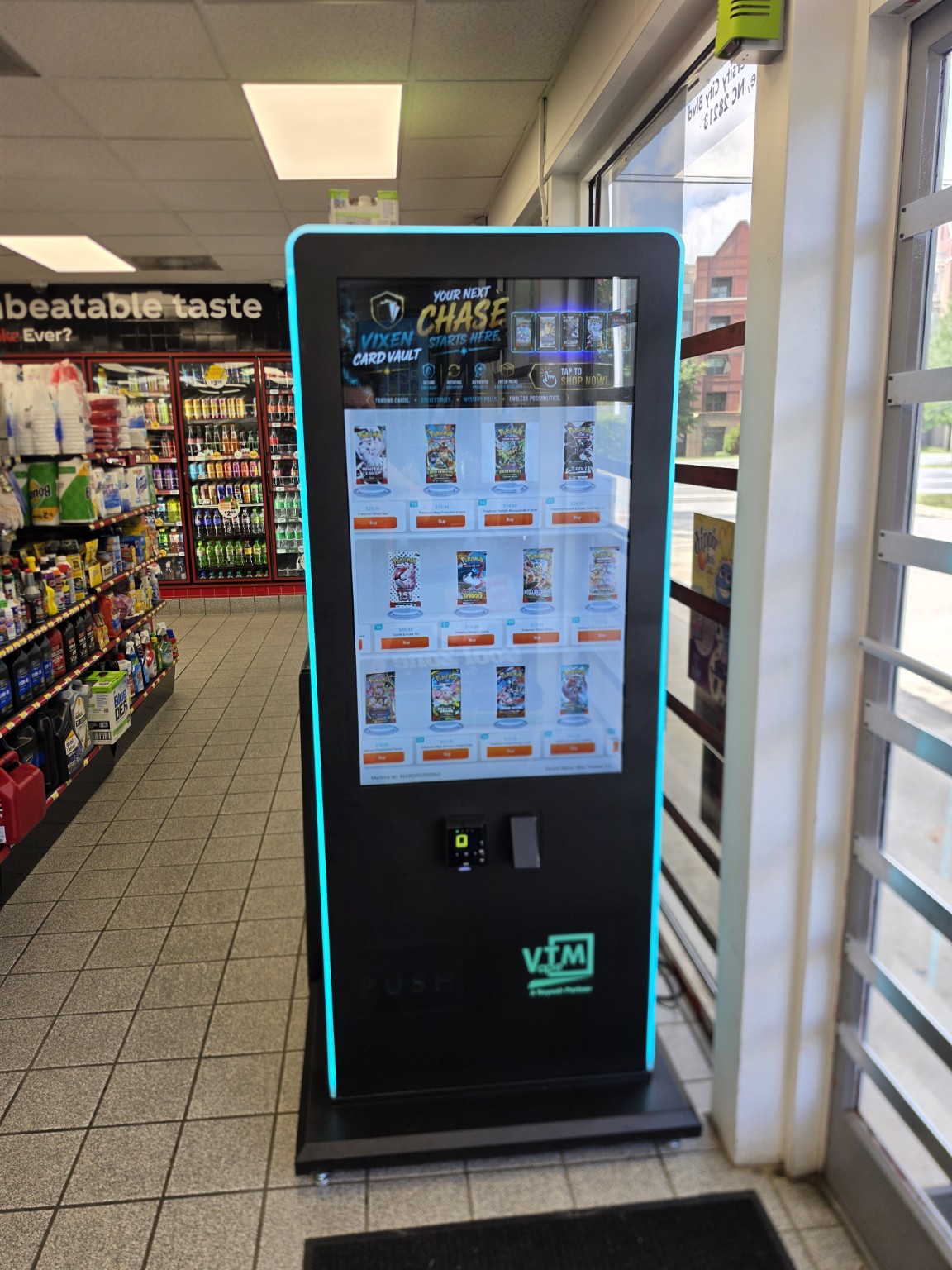Vixen Card Vault's freestanding machine displaying Pokémon trading card packs.